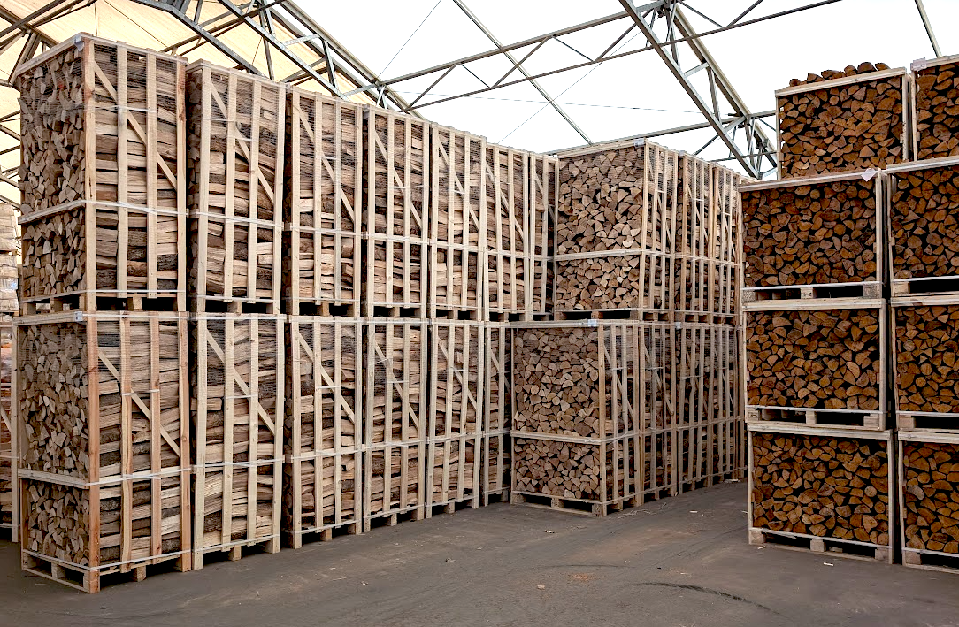 Crates of kiln-dried Oak hardwood firewood logs stacked in Perth warehouse, ready for UK-wide delivery - eco-friendly and low moisture content.